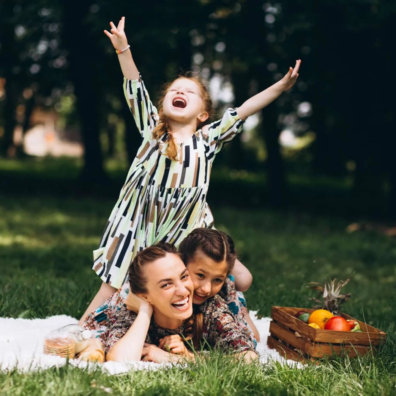 A happy family enjoying a picnic on a lush green lawn